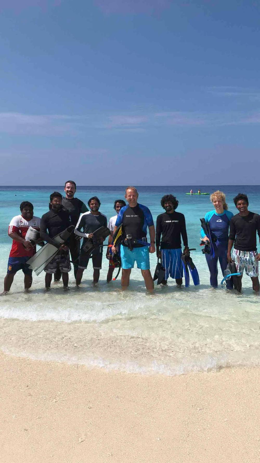 The team on the beach after a day of coral restoration work